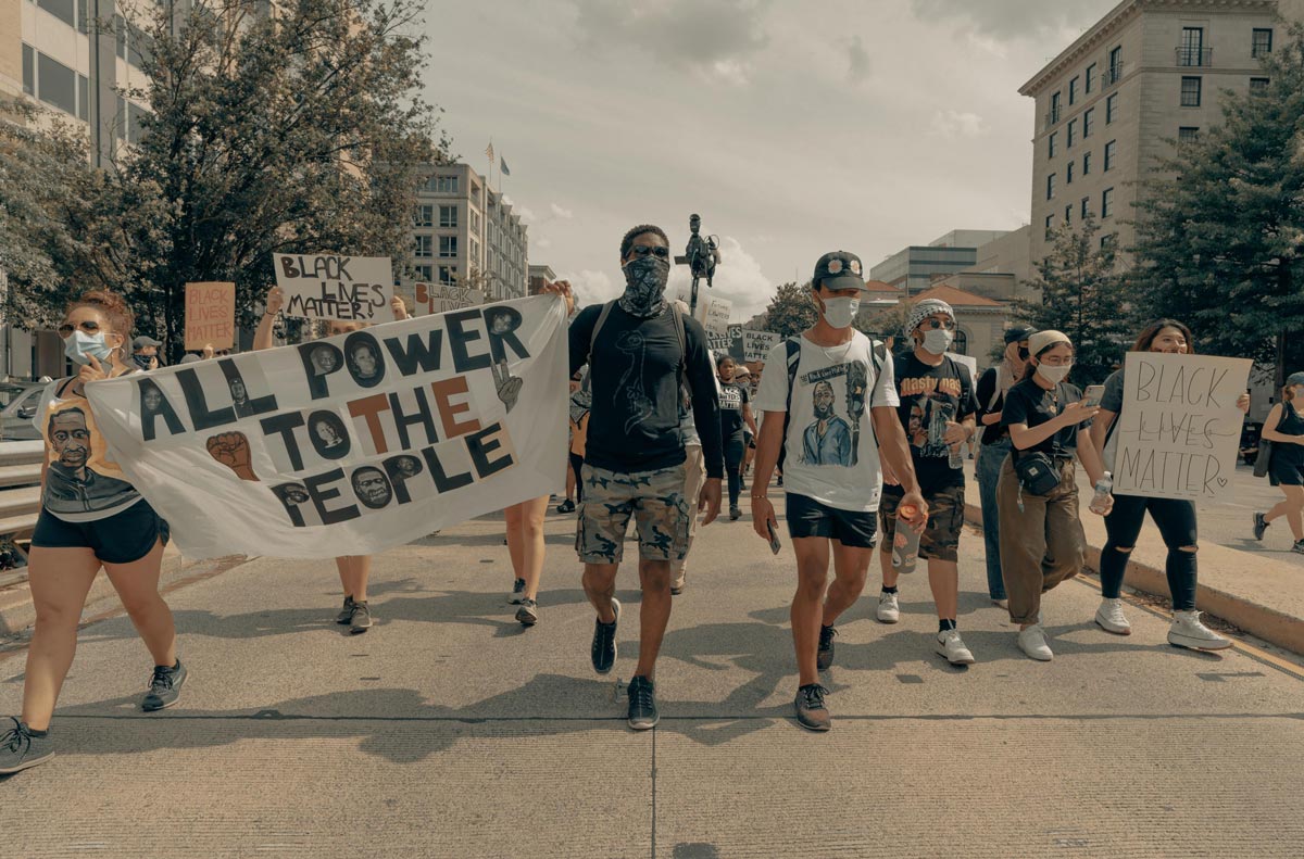 protesters, group of people walking, urban city