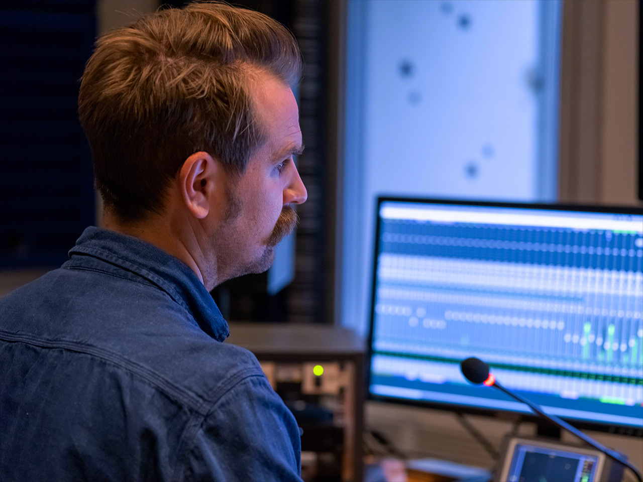 man at workstation, computer screen